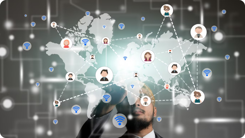 Person drawing a virtual network of interconnected people over a world map, representing global communication and connectivity.