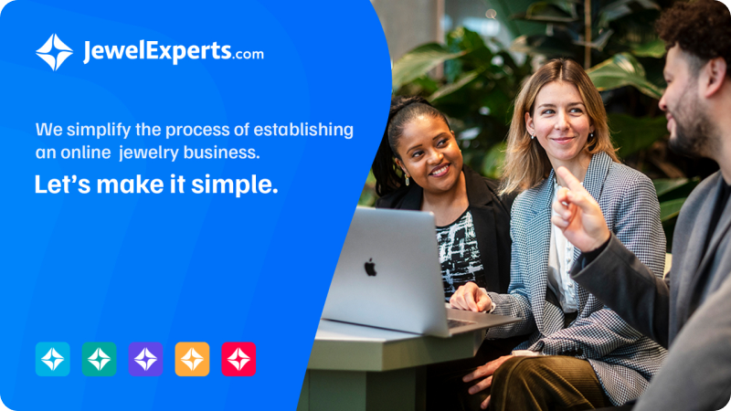 JewelExperts.com advertisement showing three people smiling and discussing around a laptop with the text 'We simplify the process of establishing an online jewelry business. Let's make it simple.