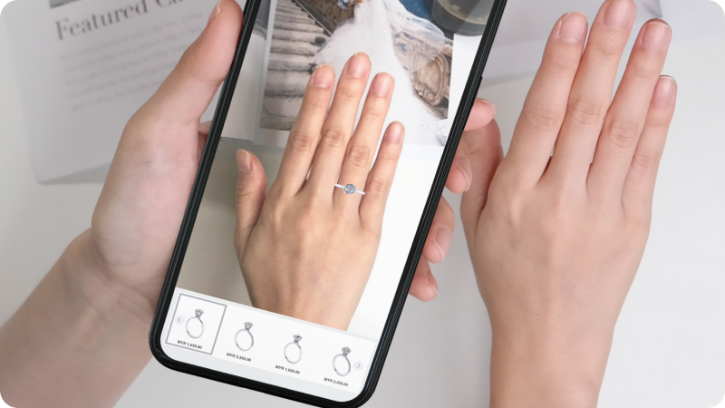 Person using a mobile app to virtually try on a diamond ring.