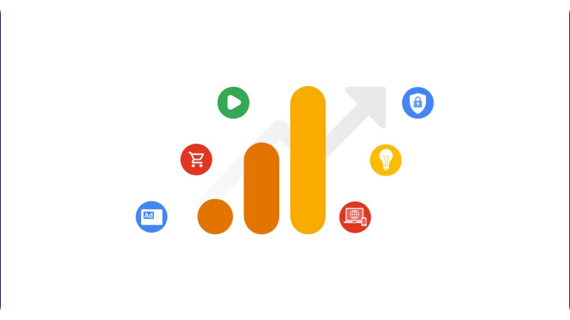 A graphical representation of Google Analytics with a stylized bar chart in orange and yellow tones, symbolizing data analysis and growth. Surrounding the chart are various icons representing different functionalities and features: a green play button (video), a red shopping cart (e-commerce), a blue lock (security), a yellow light bulb (ideas/insights), a red globe (global reach), and a blue advertisement icon (ads). The background is white, emphasizing the colorful and dynamic elements of the graphic.