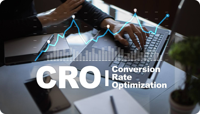 Person working on a laptop with a graph overlay and the text 'CRO | Conversion Rate Optimization.