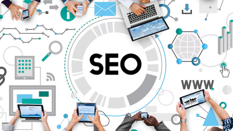 SEO concept with people using laptops, tablets, and smartphones around a central SEO graphic with various digital marketing icons.