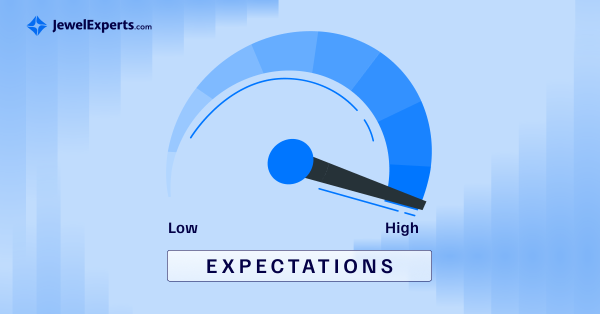 Gauge meter showing high expectations, with the needle pointing towards the 'High' end of the scale. The meter is labeled 'EXPECTATIONS' and ranges from 'Low' to 'High'. The image has a blue color scheme and includes the JewelExperts.com logo.